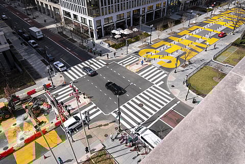 From the top of a building, the Black Lives Matter mural is seen as demolition begins at left, Monday, March 10, 2025, in Washington.