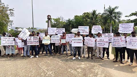 Around 50 PhD scholars from various departments Bharathiar University held a sit-in protest on campus Tuesday, opposing increased fees for synopsis, thesis, and revision submissions.