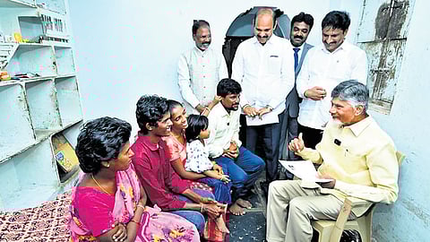 Chief Minister Nara Chandrababu Naidu interacting with the family members of an NTR Bharosa beneficiary at Kothagollapalem village in Parchur on Tuesday.