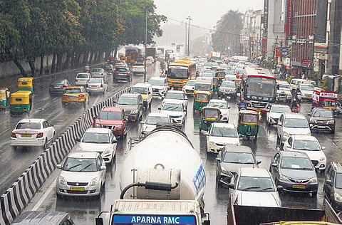 Rain brings vehicluar traffic to a standstill on a busy road on
Thursday.