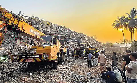 Rescuers on the job at the Sky Villa Condo that collapsed in Friday’s earthquake in Mandalay in Myanmar