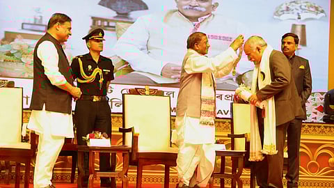 Bihar Governor Lakshman Prasad Acharya presenting the Assam Baibhav Award, state’s highest civilian honour, to Lt Gen (retd) Rana Pratap Kalita, in the presence of Chief Minister Himanta Biswa Sarma at a programme in Guwahati on Thursday, April 3