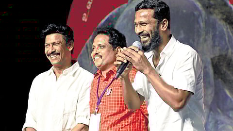 Director Vetrimaaran addressing the CPM party congress on Friday as actor P Samuthirakani and Madurai MP Su Venkatesan look on
