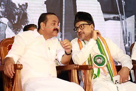 Leader of Opposition V D Satheesan and Indian Union Muslim League state president Sayyid Sadiq Ali Shihab Thangal interacting during the remembrance meeting for former state finance minister K T George at St Philomina Parish Hall, Koonammavu, Kochi, on Thursday