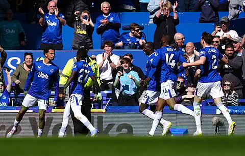 Everton's Iliman Ndiaye, left, celebrates scoring their side's first goal of the game during the English Premier League soccer match between Everton and Arsenal at Goodison Park, Liverpool, England, Saturday, April 5, 2025.