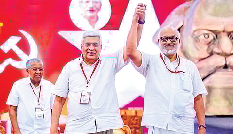 M A Baby, the newly elected general secretary of CPM, and politburo coordinator Prakash Karat raise hands during the 24th Party Congress in Madurai on Sunday.