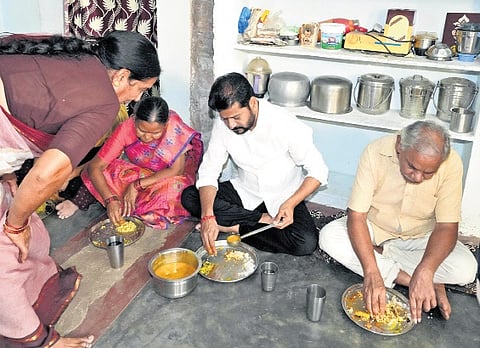 The chief minister has lunch at the residence of a ‘sanna biyyam’ scheme beneficiary at Mutyalampeta village on Sunday.