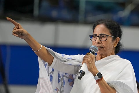 West Bengal Chief Minister Mamata Banerjee speaks during meeting with people who lost their jobs after a Supreme Court verdict invalidated the appointment of 25,753 teachers and other staff in state-run and state-aided schools in West Bengal, at Netaji Indoor Stadium, in Kolkata, Sunday, April 7, 2025.
