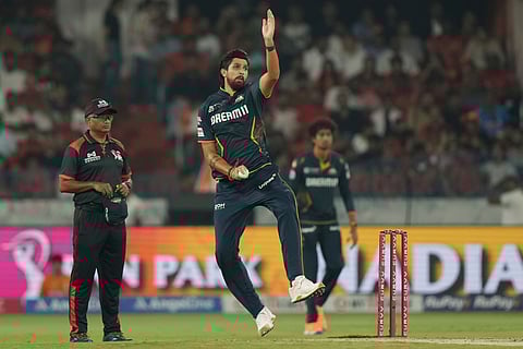 Gujarat Titans' Ishant Sharma bowls a delivery during the Indian Premier League cricket match between Sunrisers Hyderabad and Gujarat Titans at Rajiv Gandhi International Cricket Stadium in Hyderabad, India, Sunday, April 6, 2025.