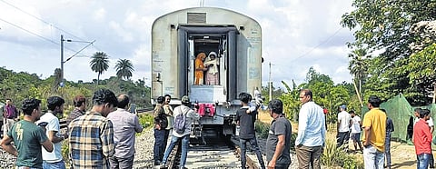 Railway staff carry out rescue operations at the mishap site.