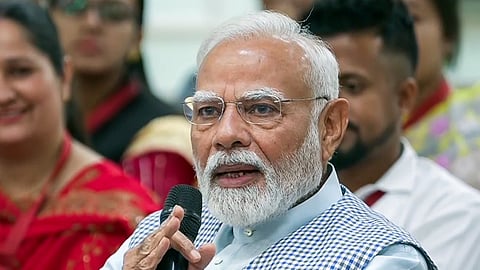 Prime Minister Narendra Modi interacts with 'Mudra Yojana' beneficiaries during the 10th anniversary of Pradhan Mantri Mudra Yojana (PMMY), in New Delhi on Tuesday.