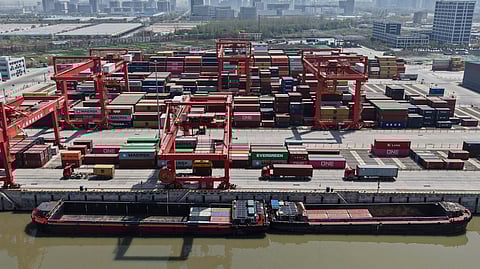 An aerial view of Xiasha Container Terminal on a canal in Hangzhou in east China's Zhejiang province Sunday, April 06, 2025.
