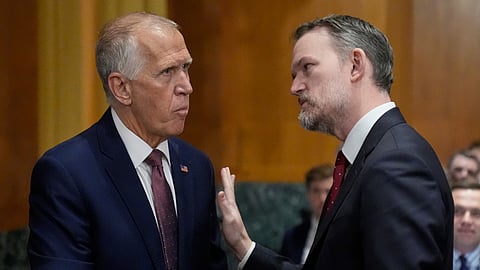 Sen. Thom Tillis, R-N.C., left, talks with US Trade Representative Jamieson Greer ahead of a hearing at the Senate Finance Committee on Capitol Hill in Washington, Tuesday, April 8, 2025.