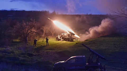 Ukrainian servicemen fire a multiple launch rocket system based on a pickup truck in the Zaporizhzhia region, Ukraine, Tuesday, April 8, 2025.