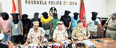 Rourkela police officials with the nine accused in the stock trading scam.