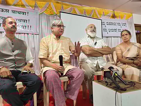 veteran environmentalist Dilip Kamat, Nithin Dhond and others speaking to the presspersons at a public meeting in Khanapur on Wednesday