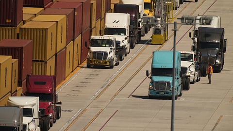Trucks await loading shipping containers at the Port of Los Angeles on Wednesday, April 9, 2025, in Los Angeles.