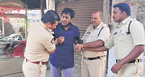 TDP activist Chebrolu Kiran Kumar being arrested in Guntur on Thursday.