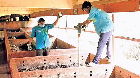 Members of HEAL Ponnurunni society at the waste treatment plant under Ponnurunni railway overbridge (below) fertiliser ‘Heal Environment’ produced from food waste.