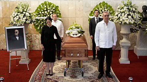 Dominican Republic President Luis Abinader, front right ands his wife Raquel Arbaje Soni, front left, attend the wake of Dominican singer Rubby Perez who died in the roof collapse at the Jet Set nightclub during his merengue concert, at the Eduardo Brito National Theater in Santo Domingo, Dominican Republic, Thursday, April 10, 2025.