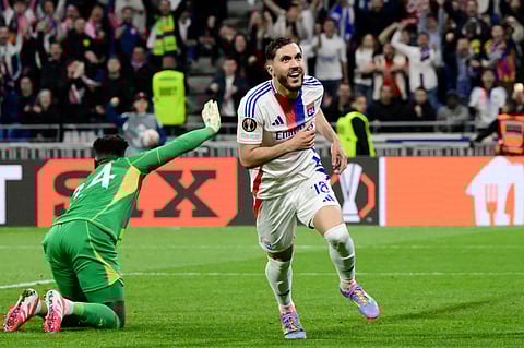 Lyon's French midfielder #18 Rayan Cherki celebrates scoring his team's second goal during the UEFA Europa League Quarter final first leg football match between Olympique Lyonnais (OL) and Manchester United on April 10, 2025.