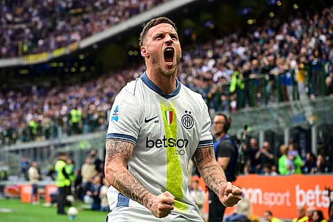 Inter Milan's Austrian forward #08 Marko Arnautovic celebrates after scoring his team's first goal during the Italian Serie A football match between Inter Milan and Cagliari at San Siro stadium in Milan, Italy on April 12, 2025.