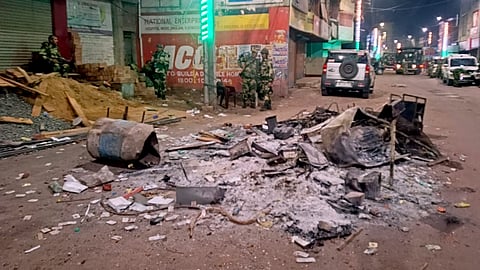 Security personnel keep a vigil at an area amid protests over the Waqf (Amendment) Act, in Murshidabad district, West Bengal, Saturday, April 12, 2025.