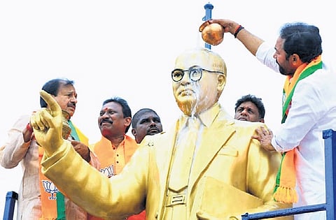 Union Minister G Kishan Reddy offers ‘palabhishekam’ to the Dr BR Ambedkar statue at Banjara Hills in Hyderabad.