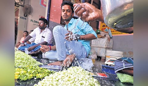 Vendors selling jasmine at Madurai flower market on Sunday