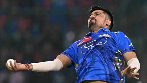 Mumbai Indians' Karn Sharma celebrates after taking the wicket of Delhi Capitals' KL Rahul during the Indian Premier League (IPL) Twenty20 cricket match between Delhi Capitals and Mumbai Indians at the Arun Jaitley Stadium in New Delhi on April 13, 2025.