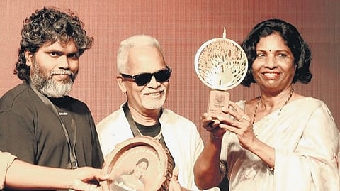 P Sivakami receiving the Verchol Dalit Literary Award on Sunday