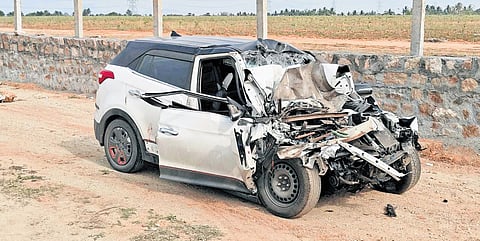 The mangled remains of the front portion of the car after the collision.