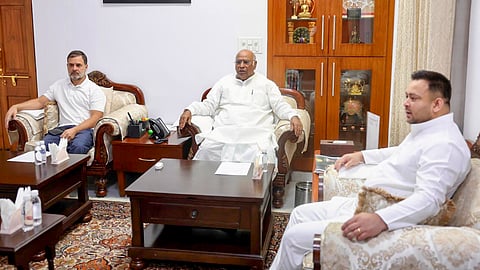 In this image from AICC on Tuesday, April 15, 2025, Congress President Mallikarjun Kharge with LoP in the Lok Sabha and party leader Rahul Gandhi and RJD leader Tejashwi Yadav during a meeting, in New Delhi.