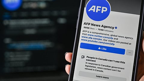 This illustration photo taken on April 14, 2025, in Montreal, Canada, shows the alert: “People in Canada can’t see this content” on the Facebook page of news organization Agence France-Presse (AFP).