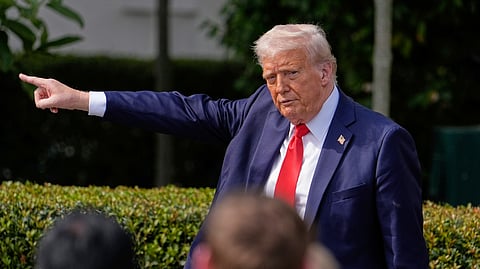 US President Donald Trump gestures to the crowd during an event on the South Lawn of the White House, Monday, April 14, 2025, in Washington.