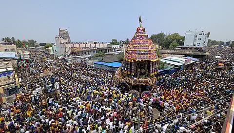 Unmindful of the heat, several thousands of devotees witnessed the car procession of the Samayapuram Mariamman temple, held on Tuesday as part of the annual chithirai festival.