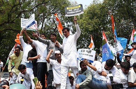 Congress workers and leaders shouting slogans during their protest against the Enforcement Directorate filing charges against former Congress president Sonia Gandhi and Leader of Opposition in Lok Sabha Rahul Gandhi at AICC in New Delhi.