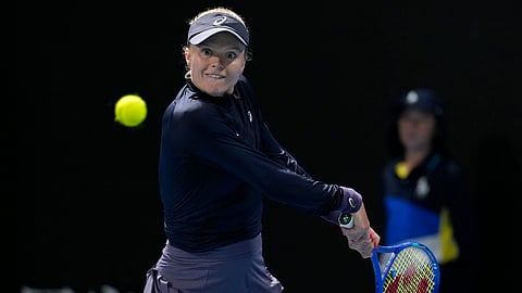 Harriet Dart of Britain plays a backhand return to Donna Vekic of Croatia during their second round match at the Australian Open tennis championship in Melbourne, Australia, Jan. 15, 2025.