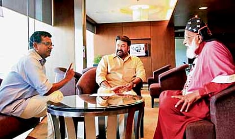Blessy along with Mohanlal and Chrisostom Thirumeni during the shooting of documentary.