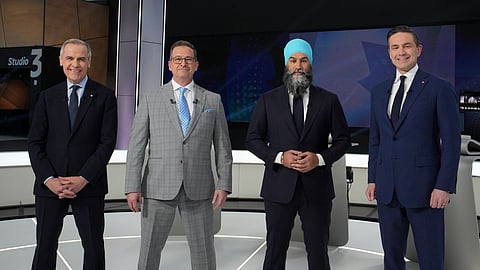 From left to rigt, Liberal leader Mark Carney, Bloc Quebecois Leader Yves-Francois Blanchet, New Democratic Party Leader Jagmeet Singh and Conservative Leader Pierre Poilievre pose for a photo before the French-language federal leaders' debate, in Montreal, Wednesday, April 16, 2025.