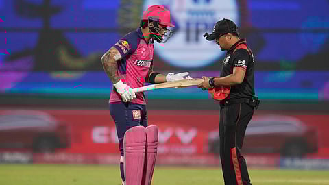 Umpire checking the bat of Riyan Parag