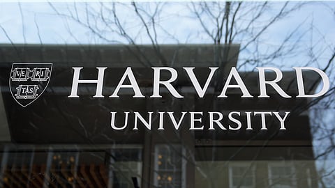 The Harvard University logo is displayed on a building at the school, Tuesday, April 15, 2025, in Cambridge, Mass.