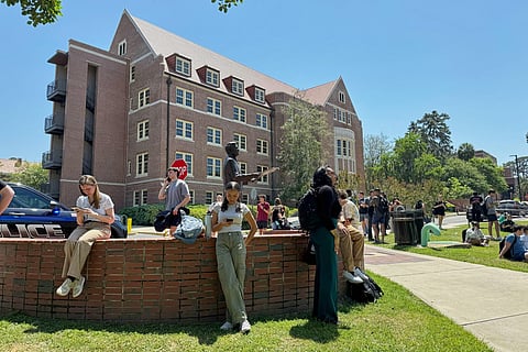 Florida State University students wait for news amid an active shooter incident at the school’s campus in Tallahassee, Fla., Thursday, April 17, 2025.