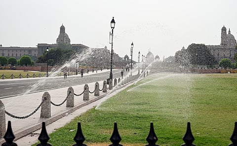 Sprinklers being operated at the lawns of Kartavya Path amid rising temperatures in New Delhi.