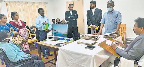 State Human Rights Commission member V Kannadasan presiding over a grievance redressal meet in Tirunelveli on Thursday.