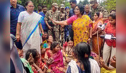 National Commission for Women (NCW) Chairman Vijaya Rahatkar and other officials of the commission during a meeting with riot-affected people, in Murshidabad district, West Bengal, Saturday.