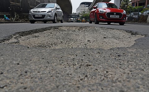 Huge pothole on busy mysuru road Metro station in Bengaluru