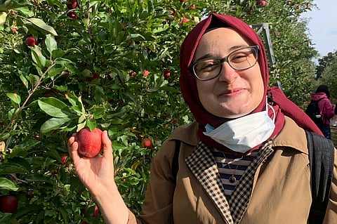 This contributed photo shows Rumeysa Ozturk on an apple-picking trip in 2021.