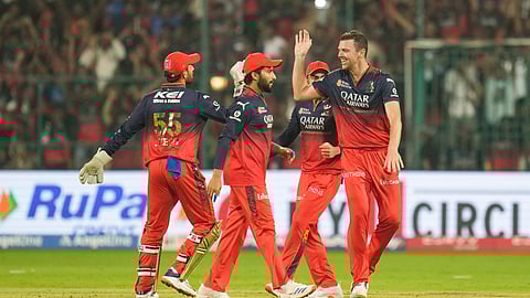 RCB's J Hazelwood with Virat Kohli and teammates celebrates the wicket of PBKS' Shreyas Iyer during the IPL 2025 cricket match between Royal Challengers Bengaluru and Punjab Kings on Friday, April 18, 2025.