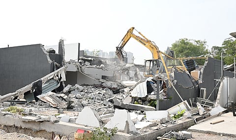 HYDRAA officials razed illegal constructions in Dollar Hills, Puppalaguda, under Manikonda municipality limits.